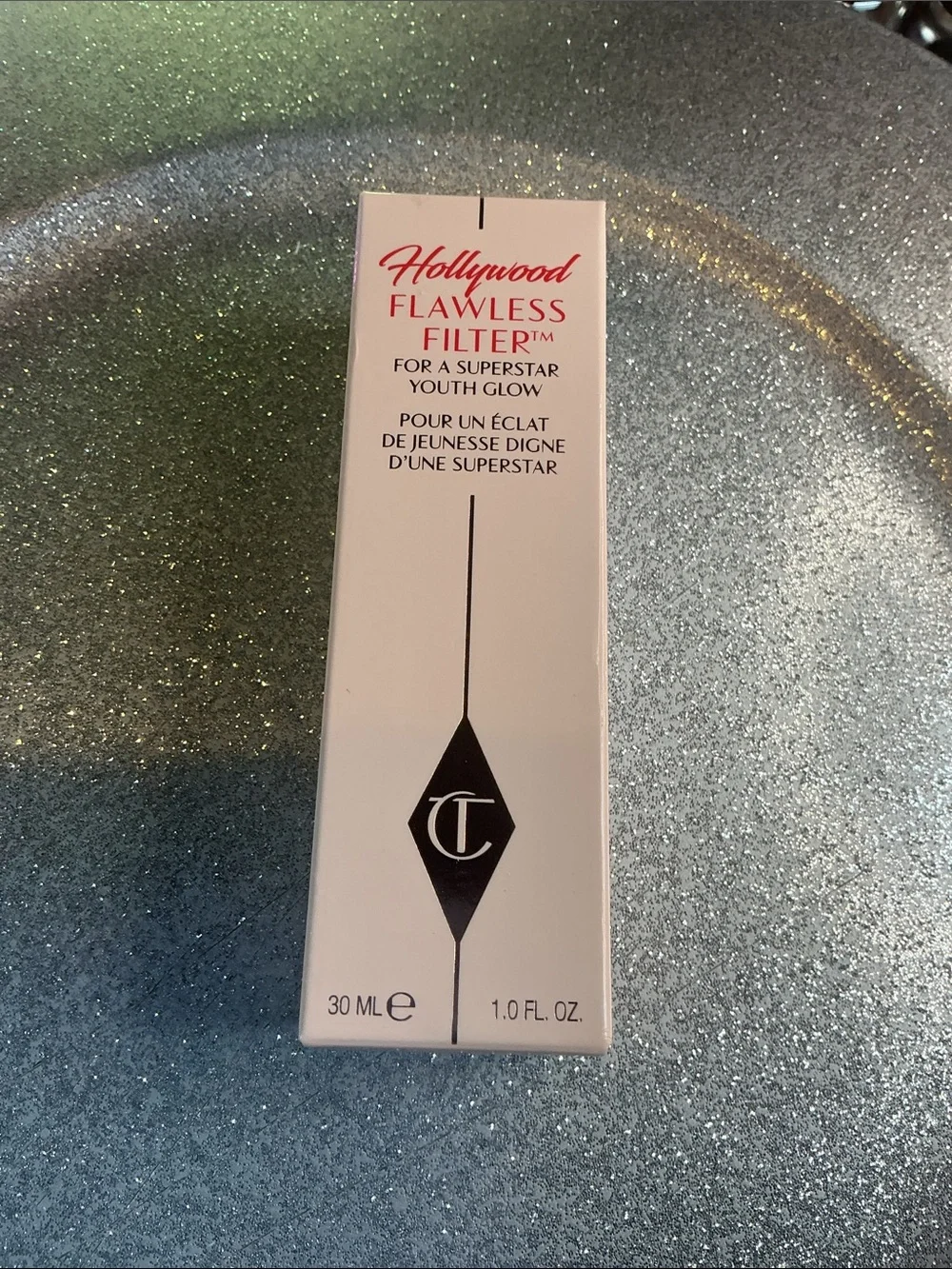 Product Box on Glitter Surface